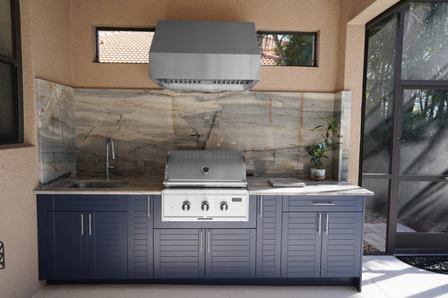 Compact outdoor kitchen cabinets in Indigo HDPE with built-in grill and stone backsplash