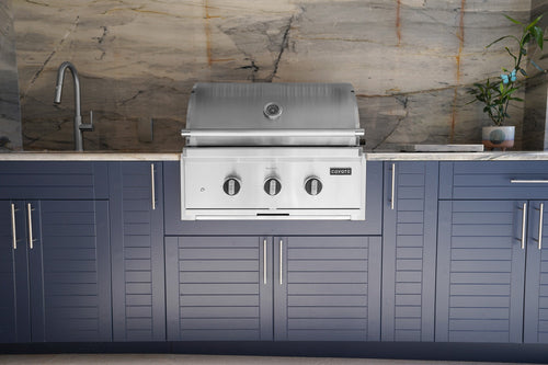 Stainless grill built into HDPE outdoor kitchen cabinets, close-up view