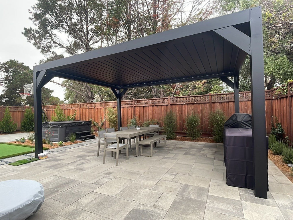 Black Sundance All Season motorized louvered pergola in a freestanding mount on a backyard patio