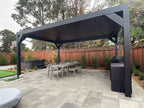 Black Sundance All Season motorized louvered pergola in a freestanding mount on a backyard patio