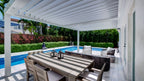 Sundance All Season louvered pergola as a poolside cabana in a premium backyard retreat