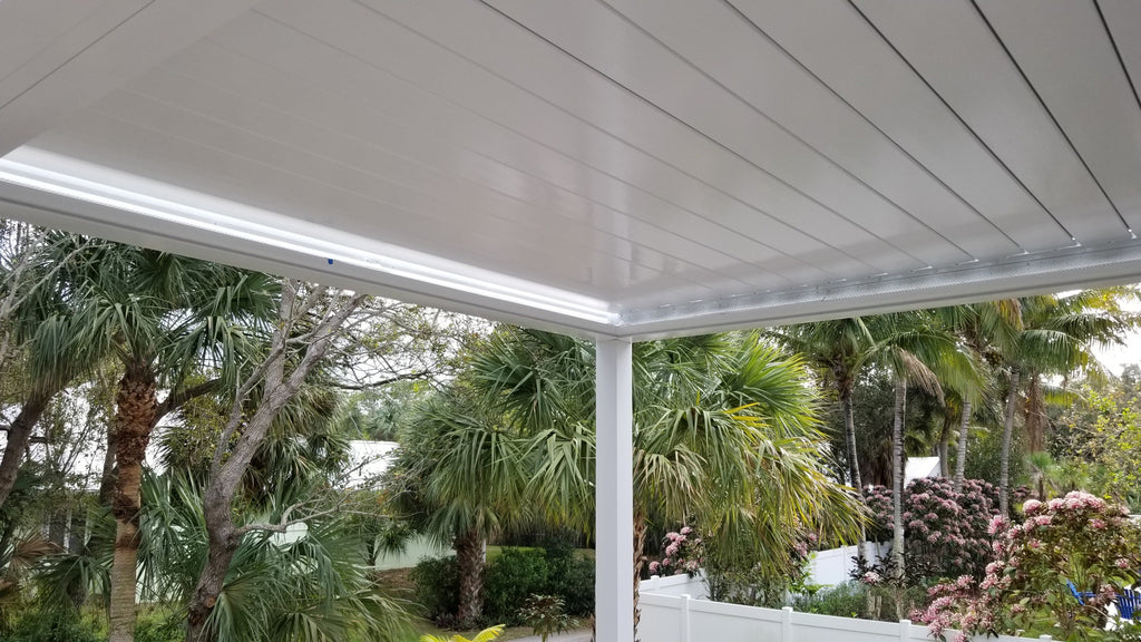 Close-up of a white Sundance louvered pergola roof with louvers closed showing aluminum build quality